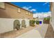 Backyard with lush green lawn and gravel landscaping against a wall at 2551 E Buena Vista Pl, Chandler, AZ 85249