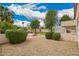 Expansive backyard featuring a fire pit, privacy landscaping, and gravel groundcover at 2551 E Buena Vista Pl, Chandler, AZ 85249