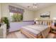 Serene bedroom with a king bed, natural light, and neutral tones, offering a peaceful retreat at 2551 E Buena Vista Pl, Chandler, AZ 85249
