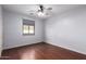 Bright bedroom with hardwood flooring and window with roller shade at 2551 E Buena Vista Pl, Chandler, AZ 85249