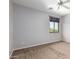 Carpeted bedroom with a window and neutral wall color scheme at 2551 E Buena Vista Pl, Chandler, AZ 85249