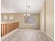 Elegant dining area with stylish chandelier and view of railing for an open and airy feel at 2551 E Buena Vista Pl, Chandler, AZ 85249