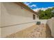 Exterior view of the home showing the stucco walls and pebble landscaping at 2551 E Buena Vista Pl, Chandler, AZ 85249