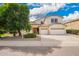 Charming two-story home with a three car garage, desert landscaping, and a mature shade tree in the front yard at 2551 E Buena Vista Pl, Chandler, AZ 85249