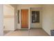 Beautiful wood front door with a covered porch entry at 2551 E Buena Vista Pl, Chandler, AZ 85249