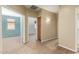 Neutral hallway featuring beige walls and carpet with doorways leading to other rooms at 2551 E Buena Vista Pl, Chandler, AZ 85249