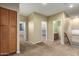 Open hallway with access to carpeted bedrooms and a bathroom, featuring storage cabinet at 2551 E Buena Vista Pl, Chandler, AZ 85249