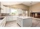 Stylish kitchen with white cabinets, kitchen island and vaulted ceilings for an open feel at 2551 E Buena Vista Pl, Chandler, AZ 85249