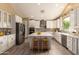 Modern kitchen with stainless steel appliances, a center island, stylish countertops, and ample cabinet space at 2551 E Buena Vista Pl, Chandler, AZ 85249