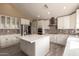 Modern kitchen features white cabinets, an island, stainless steel appliances and lots of storage at 2551 E Buena Vista Pl, Chandler, AZ 85249