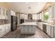Bright kitchen features a large island, stainless appliances, and white cabinetry at 2551 E Buena Vista Pl, Chandler, AZ 85249