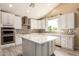 Well-appointed kitchen features granite counters, stainless appliances, and ample cabinetry at 2551 E Buena Vista Pl, Chandler, AZ 85249