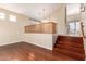Open-concept living room with hardwood floors and a staircase at 2551 E Buena Vista Pl, Chandler, AZ 85249
