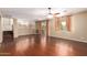 Open living room featuring hardwood floors, lots of natural light and easy access to the balcony at 2551 E Buena Vista Pl, Chandler, AZ 85249