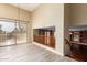 Bright living room boasts high ceilings, balcony access, and seamless indoor-outdoor flow at 2551 E Buena Vista Pl, Chandler, AZ 85249