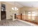 Bright living room features high ceilings, railing and stairs for an open and airy feel at 2551 E Buena Vista Pl, Chandler, AZ 85249