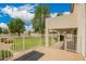 Covered patio overlooks the manicured lawn and mature trees at 2551 E Buena Vista Pl, Chandler, AZ 85249