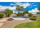 Backyard pool surrounded by palm trees and desert landscaping at 2551 E Buena Vista Pl, Chandler, AZ 85249