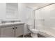 Bathroom featuring a modern vanity, toilet, and shower with glass door and window at 2650 W Union Hills Dr # 123, Phoenix, AZ 85027