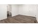 Well-lit bedroom with wood floors offering access to an ensuite bathroom and closet at 2650 W Union Hills Dr # 123, Phoenix, AZ 85027