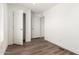 Inviting bedroom featuring wood flooring, two closets and a large window at 2650 W Union Hills Dr # 123, Phoenix, AZ 85027
