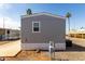 Side view of a well-kept manufactured home with low maintenance landscaping and a serene neighborhood setting at 2650 W Union Hills Dr # 123, Phoenix, AZ 85027