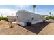 Wide angle shot of a mobile home with low maintenance desert landscaping and a neighborhood setting at 2650 W Union Hills Dr # 123, Phoenix, AZ 85027
