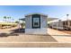 Mobile home featuring covered parking and low maintenance desert landscaping in a well-maintained community at 2650 W Union Hills Dr # 123, Phoenix, AZ 85027