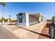 Manufactured home featuring covered parking and low maintenance desert landscaping in a well-maintained community at 2650 W Union Hills Dr # 123, Phoenix, AZ 85027