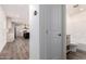 Hallway looking into the kitchen and a bathroom featuring tile flooring, and neutral paint throughout at 2650 W Union Hills Dr # 123, Phoenix, AZ 85027