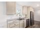 Bright kitchen featuring stainless steel appliances, neutral cabinets, and a double basin sink at 2650 W Union Hills Dr # 123, Phoenix, AZ 85027