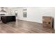 Bright kitchen with stainless steel appliances, modern wood flooring, and an eat-in kitchen island at 2650 W Union Hills Dr # 123, Phoenix, AZ 85027