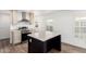 Bright kitchen with stainless steel appliances, modern wood flooring, and an eat-in kitchen island at 2650 W Union Hills Dr # 123, Phoenix, AZ 85027
