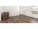 Bright living room featuring modern wood flooring, fresh neutral paint, and lots of natural light at 2650 W Union Hills Dr # 123, Phoenix, AZ 85027