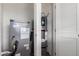 Utility closet showcasing an updated water heater and HVAC unit with white shuttered doors at 2650 W Union Hills Dr # 123, Phoenix, AZ 85027