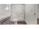 Modern bathroom with a glass-enclosed shower and tiled walls at 2650 W Union Hills Dr # 91, Phoenix, AZ 85027