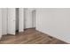 Bedroom with wood-look floors, closet, and door to another room at 2650 W Union Hills Dr # 91, Phoenix, AZ 85027