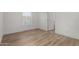 Bright bedroom with natural light, wood-look floors, and neutral walls at 2650 W Union Hills Dr # 91, Phoenix, AZ 85027