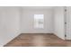 Bright bedroom with wood-look flooring and a window bringing in natural light at 2650 W Union Hills Dr # 91, Phoenix, AZ 85027