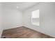 Bright bedroom with laminate flooring and a window bringing in natural light at 2650 W Union Hills Dr # 91, Phoenix, AZ 85027