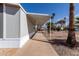 Spacious covered patio extending along the side of a well-maintained manufactured home at 2650 W Union Hills Dr # 91, Phoenix, AZ 85027