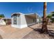Charming home with a covered patio and well-kept exterior, surrounded by mature landscaping at 2650 W Union Hills Dr # 91, Phoenix, AZ 85027