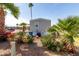 A view of the exterior elevation with palm trees and desert landscaping at 2650 W Union Hills Dr # 91, Phoenix, AZ 85027