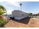 A view of the exterior elevation with palm trees and desert landscaping at 2650 W Union Hills Dr # 91, Phoenix, AZ 85027