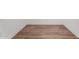 A view of the wood laminate flooring with white baseboards at 2650 W Union Hills Dr # 91, Phoenix, AZ 85027