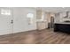 Open layout showcases kitchen with stainless steel appliances and adjacent living area, new flooring at 2650 W Union Hills Dr # 91, Phoenix, AZ 85027