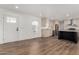 Open layout showcases kitchen with stainless steel appliances and adjacent living area, new flooring at 2650 W Union Hills Dr # 91, Phoenix, AZ 85027