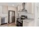 The Kitchen features stainless steel appliances, a modern range hood, and light cabinetry at 2650 W Union Hills Dr # 91, Phoenix, AZ 85027