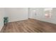 Bright living room with new wood flooring, fresh paint, and a view of the outdoors at 2650 W Union Hills Dr # 91, Phoenix, AZ 85027
