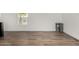 Bright living room with new wood flooring, fresh paint, and a sunlit window at 2650 W Union Hills Dr # 91, Phoenix, AZ 85027